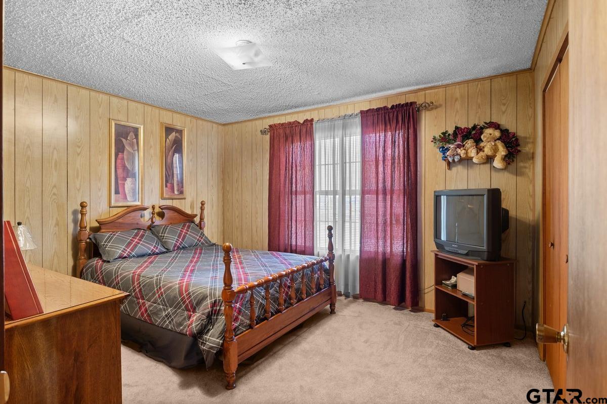807 High Street Marshall, TX 75670 - Photo 23 of 33 a bedroom with a bed and a television