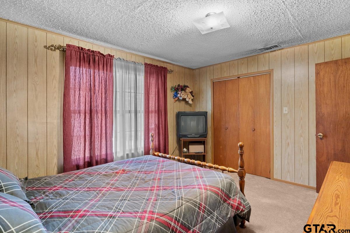 807 High Street Marshall, TX 75670 - Photo 25 of 33 a bedroom with a bed and a television