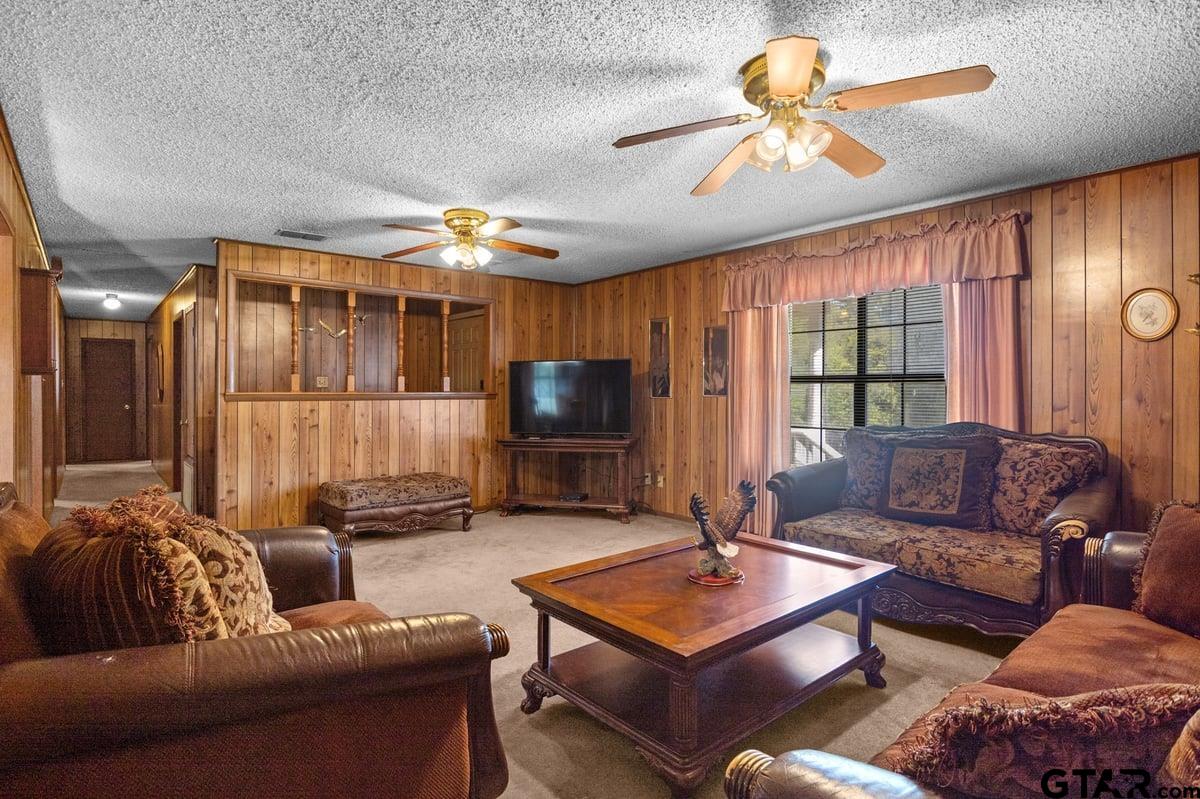 807 High Street Marshall, TX 75670 - Photo 10 of 33 a living room with furniture and a flat screen tv
