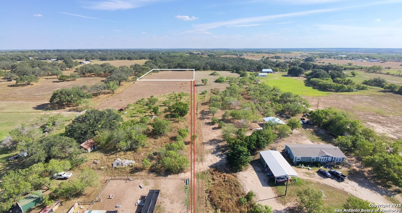 Tbd County Road 665 Devine, TX 78016 - Photo 3 of 5 an aerial view of residential houses with outdoor space