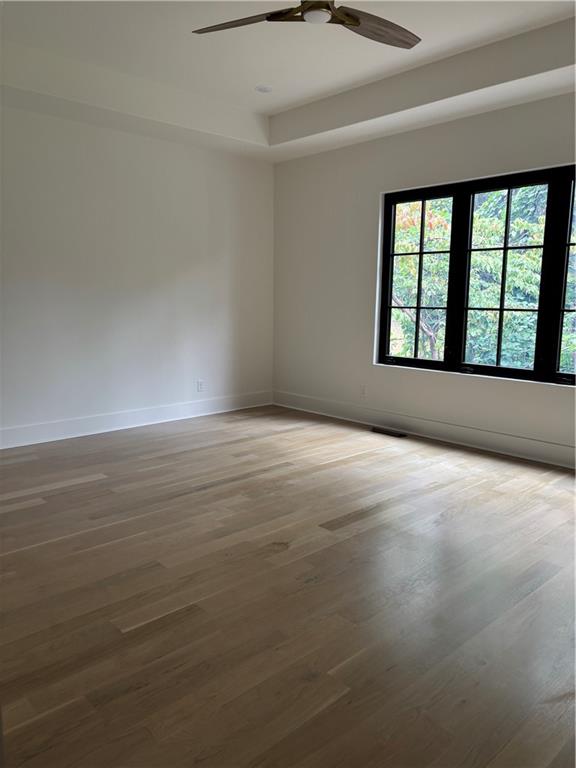 180 Thompson Place Roswell, GA 30075 - Photo 6 of 12 a view of an empty room with a window