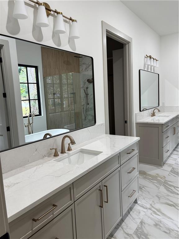 180 Thompson Place Roswell, GA 30075 - Photo 7 of 12 a bathroom with a sink and a mirror