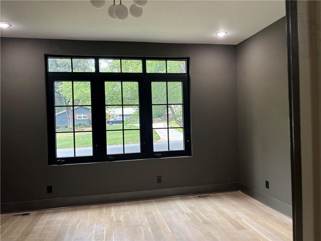 180 Thompson Place Roswell, GA 30075 - Photo 10 of 12 a view of an empty room with a window
