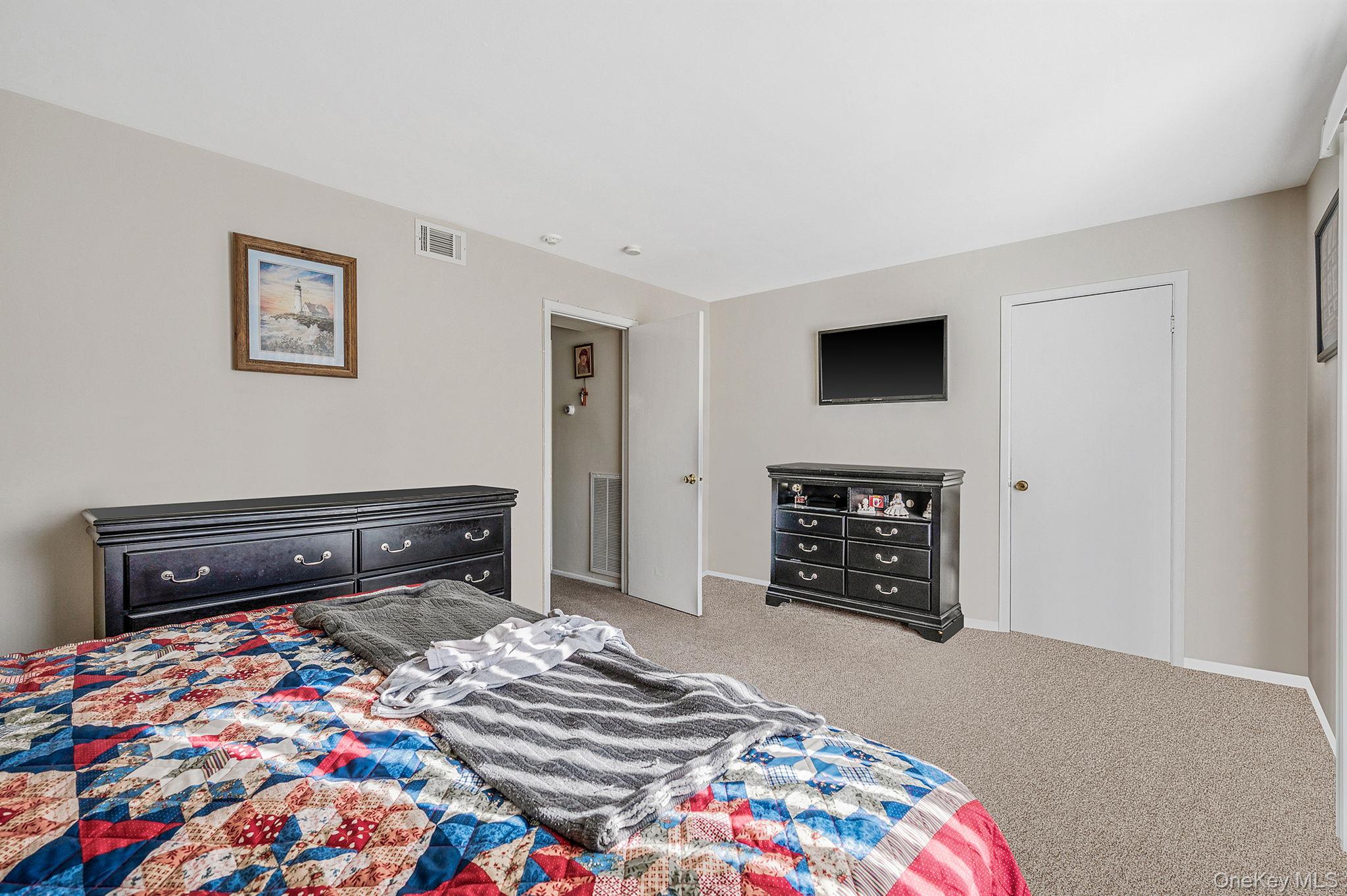 63 Rocky Point Yaphank Road, Unit 80 Rocky Point, NY 11778 - Photo 15 of 25 Bedroom with carpet floors and baseboards