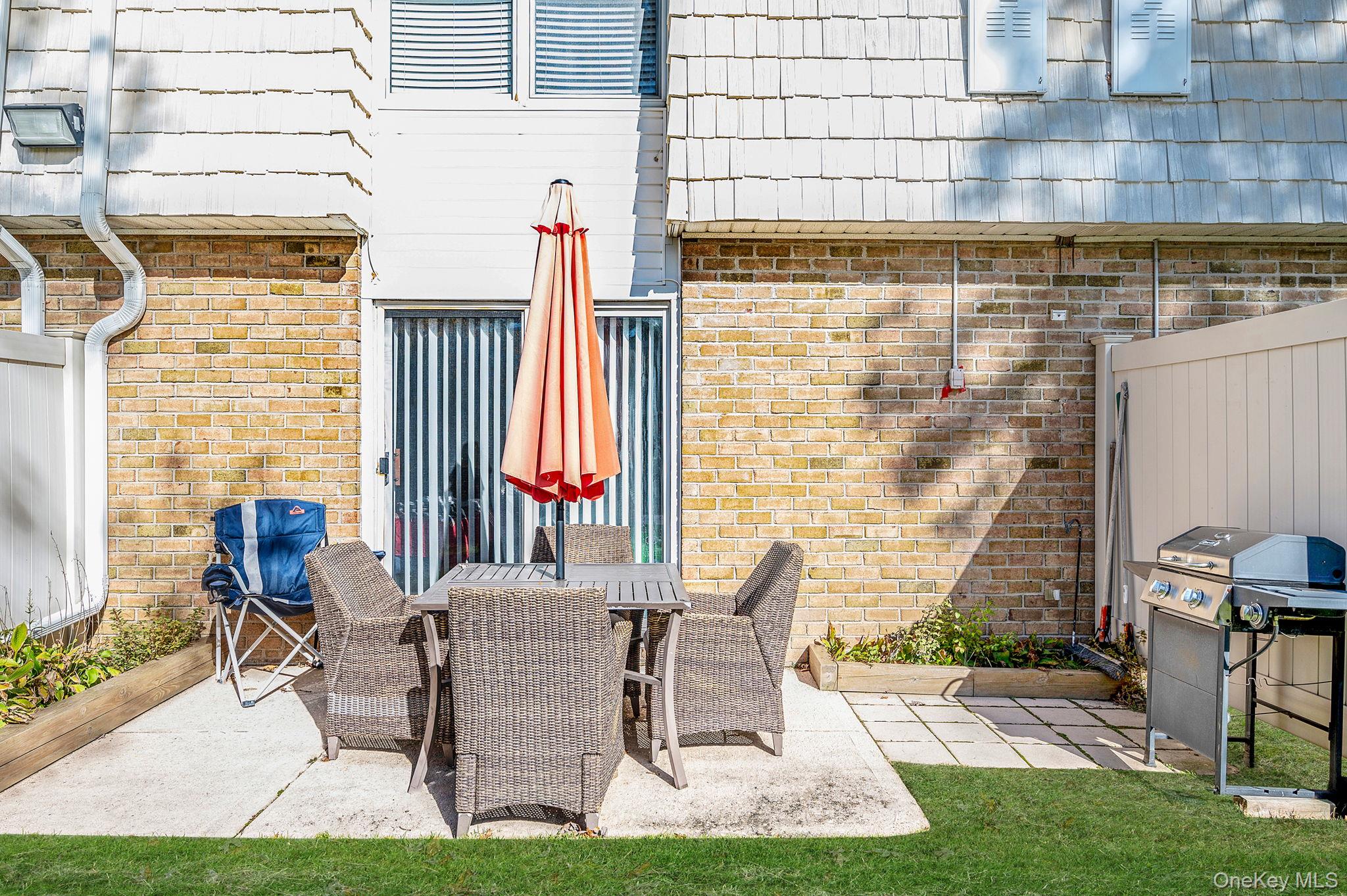 63 Rocky Point Yaphank Road, Unit 80 Rocky Point, NY 11778 - Photo 20 of 25 View of patio / terrace featuring outdoor dining space and grilling area