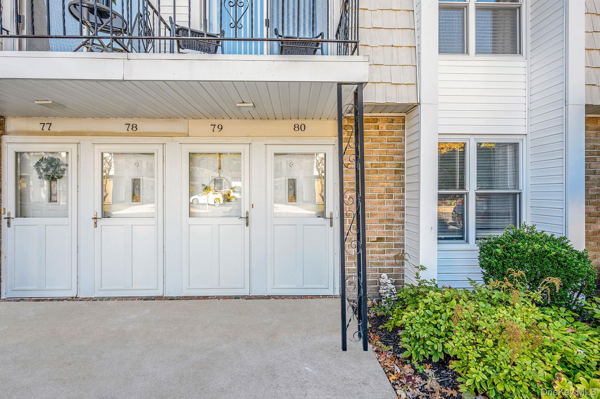 63 Rocky Point Yaphank Road, Unit 80 Rocky Point, NY 11778 - Photo 2 of 25 Entrance to property with brick siding
