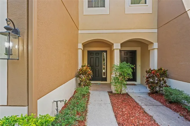 a kitchen with stainless steel appliances a refrigerator and a stove