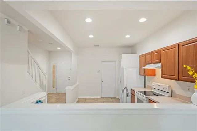 a bathroom with a granite countertop toilet and a shower
