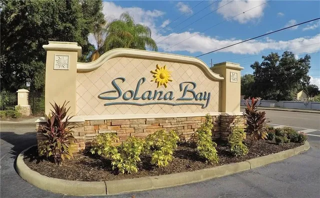 a view of a sign board with street