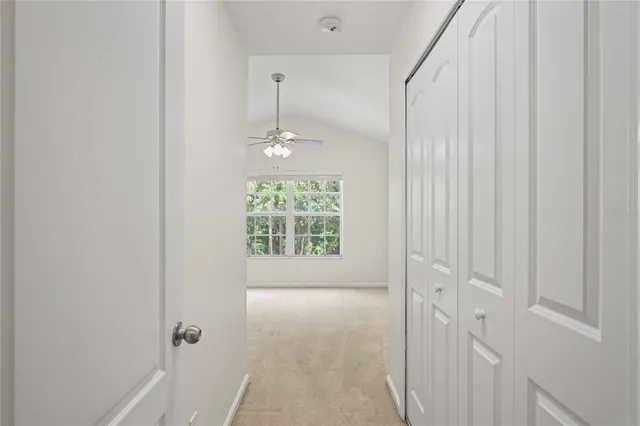 front view of a brick house with a yard