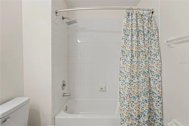 an aerial view of multiple houses with a yard