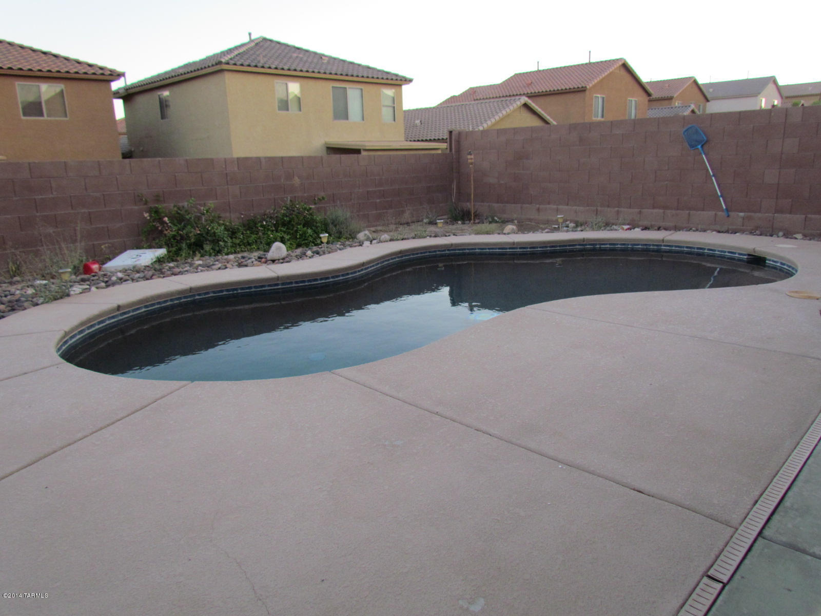 669 West Ash Ridge Drive Green Valley, AZ 85614 - Photo 1 of 17 a view of a house with a yard and plants