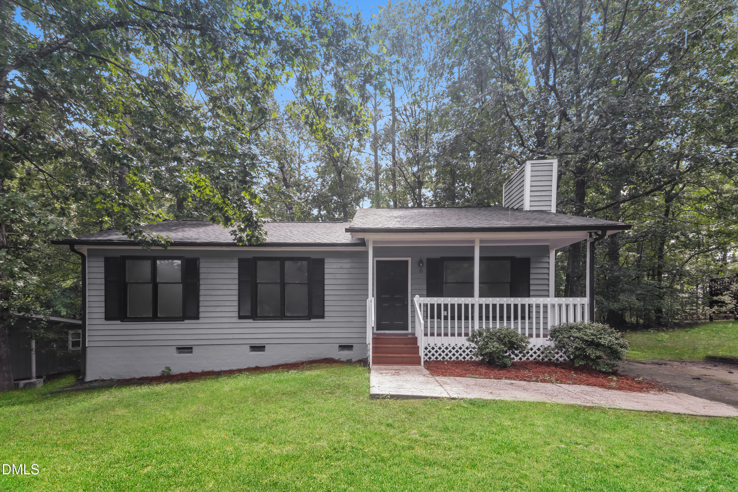 6 Fircrest Court Durham, NC 27703 - Photo 1 of 15 a front view of a house with a garden