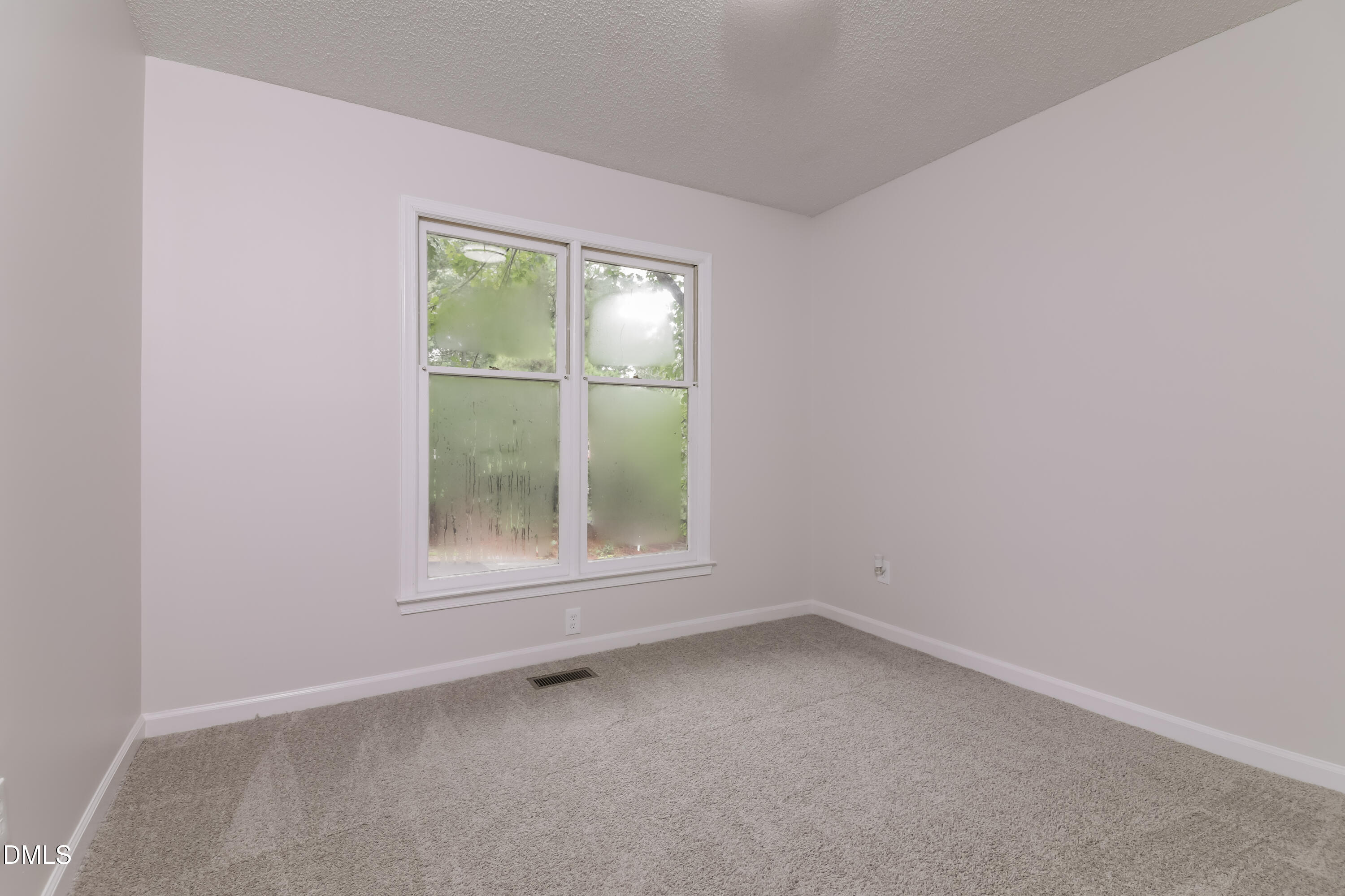 6 Fircrest Court Durham, NC 27703 - Photo 11 of 15 an empty room with a window