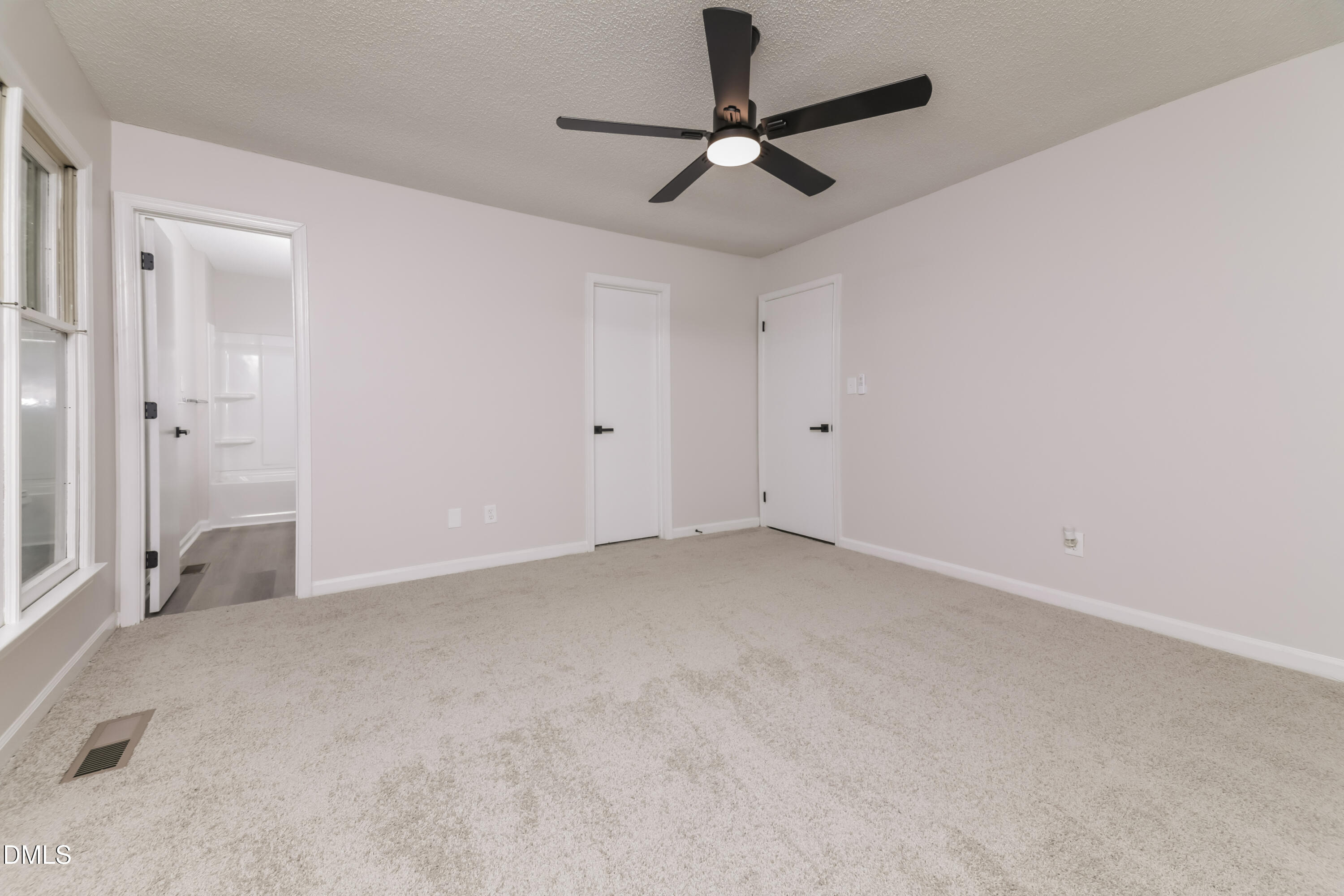 6 Fircrest Court Durham, NC 27703 - Photo 7 of 15 an empty room with chandelier fan