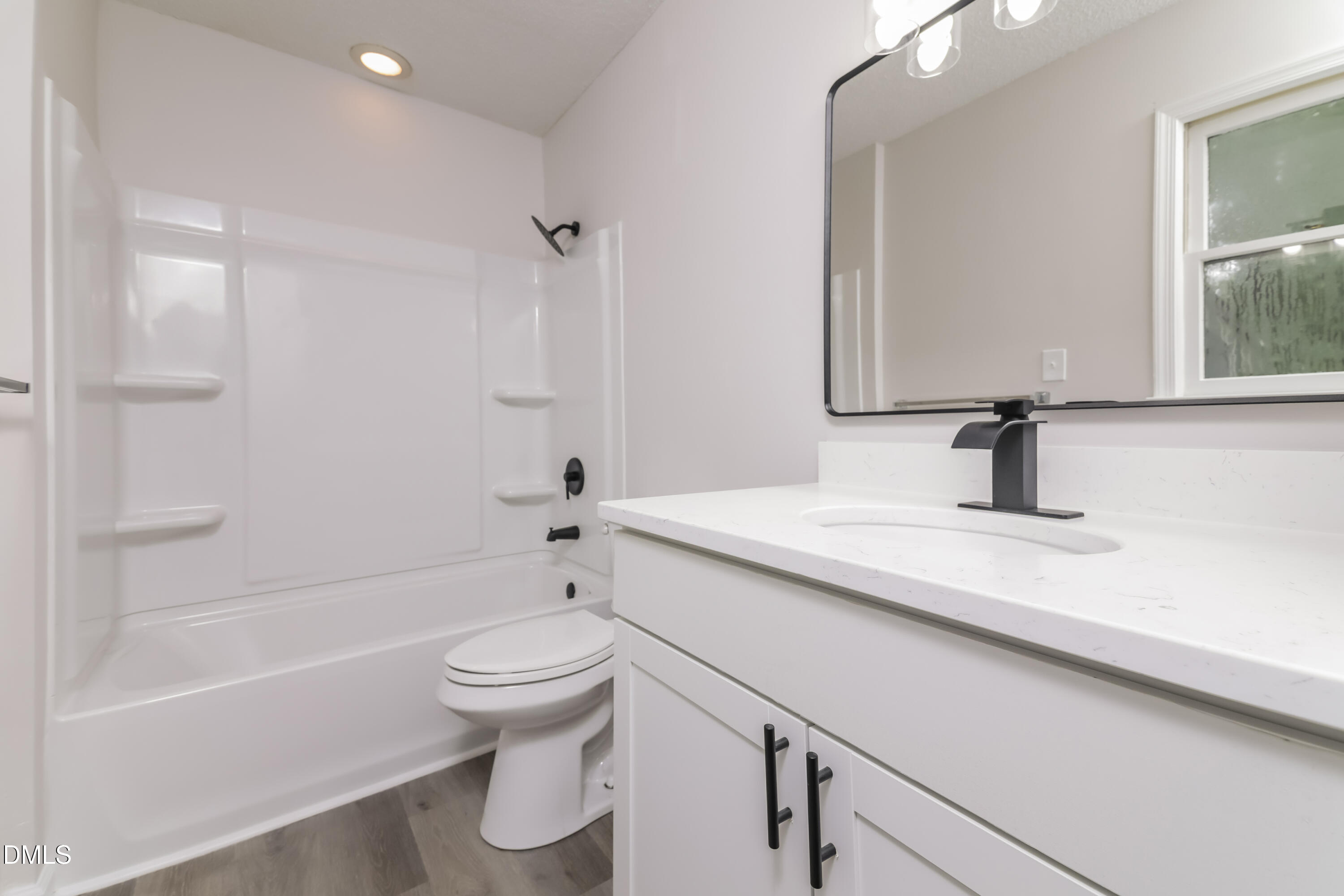 6 Fircrest Court Durham, NC 27703 - Photo 9 of 15 a bathroom with a sink a toilet and a bathtub