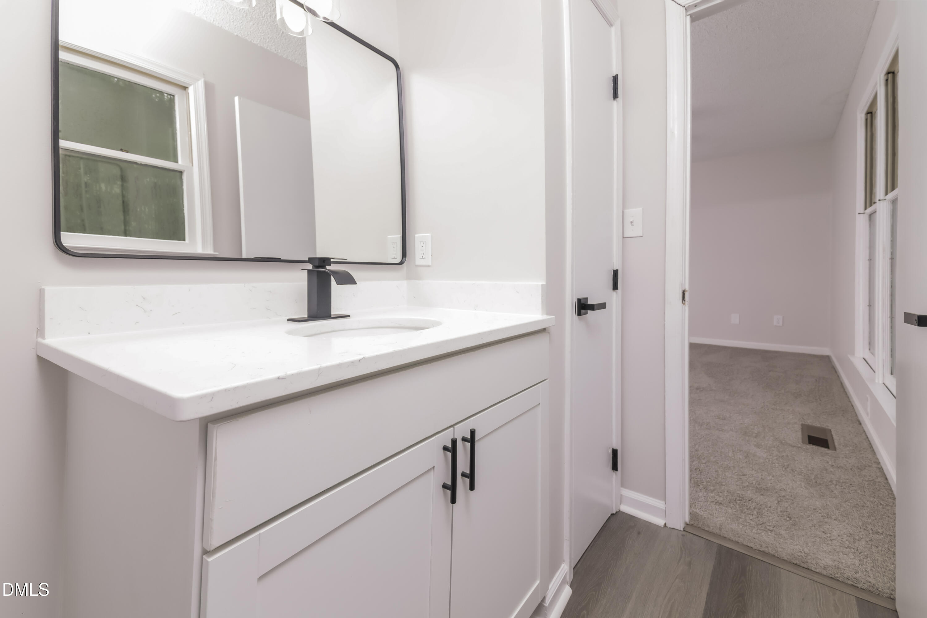 6 Fircrest Court Durham, NC 27703 - Photo 10 of 15 a bathroom with a sink and a mirror