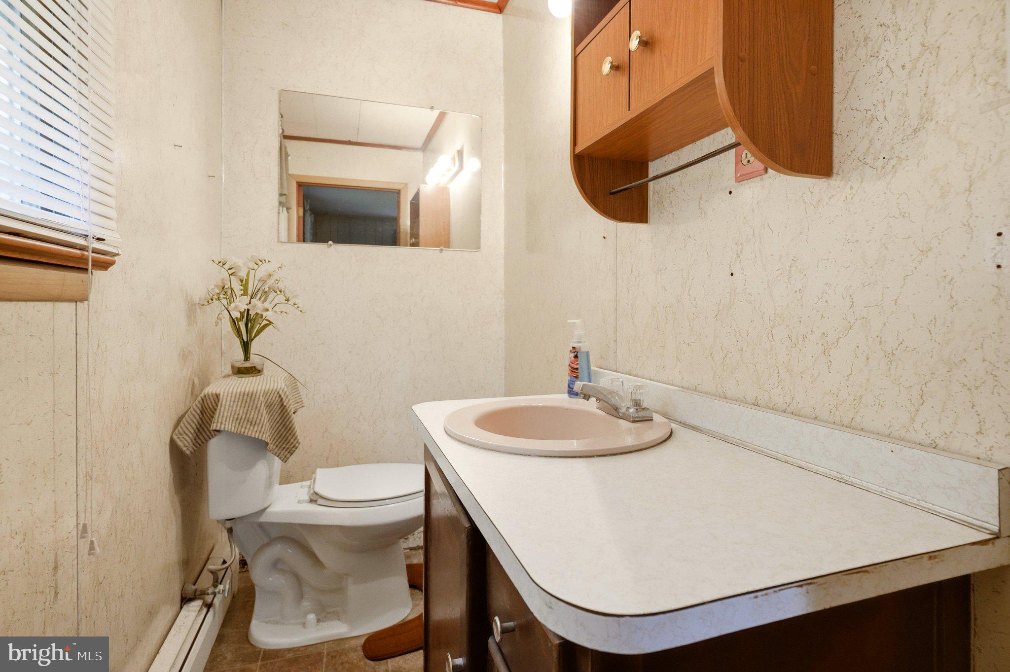 19 South Tilbury Road Salem, NJ 08079 - Photo 10 of 25 Cozy bathroom with natural light.