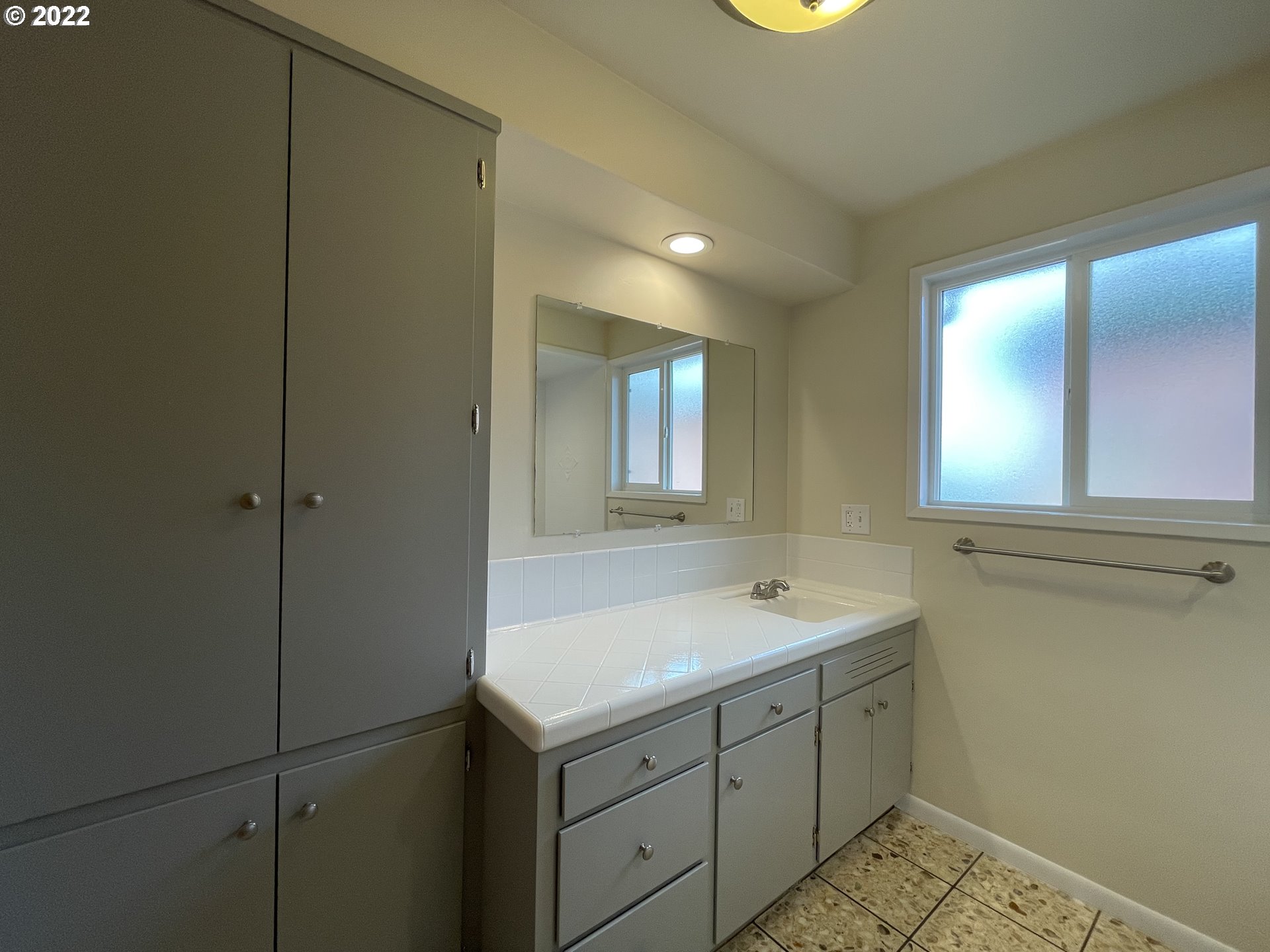 2901 Ingalls Way Eugene, OR 97405 - Photo 16 of 32 a bathroom with a sink and a mirror