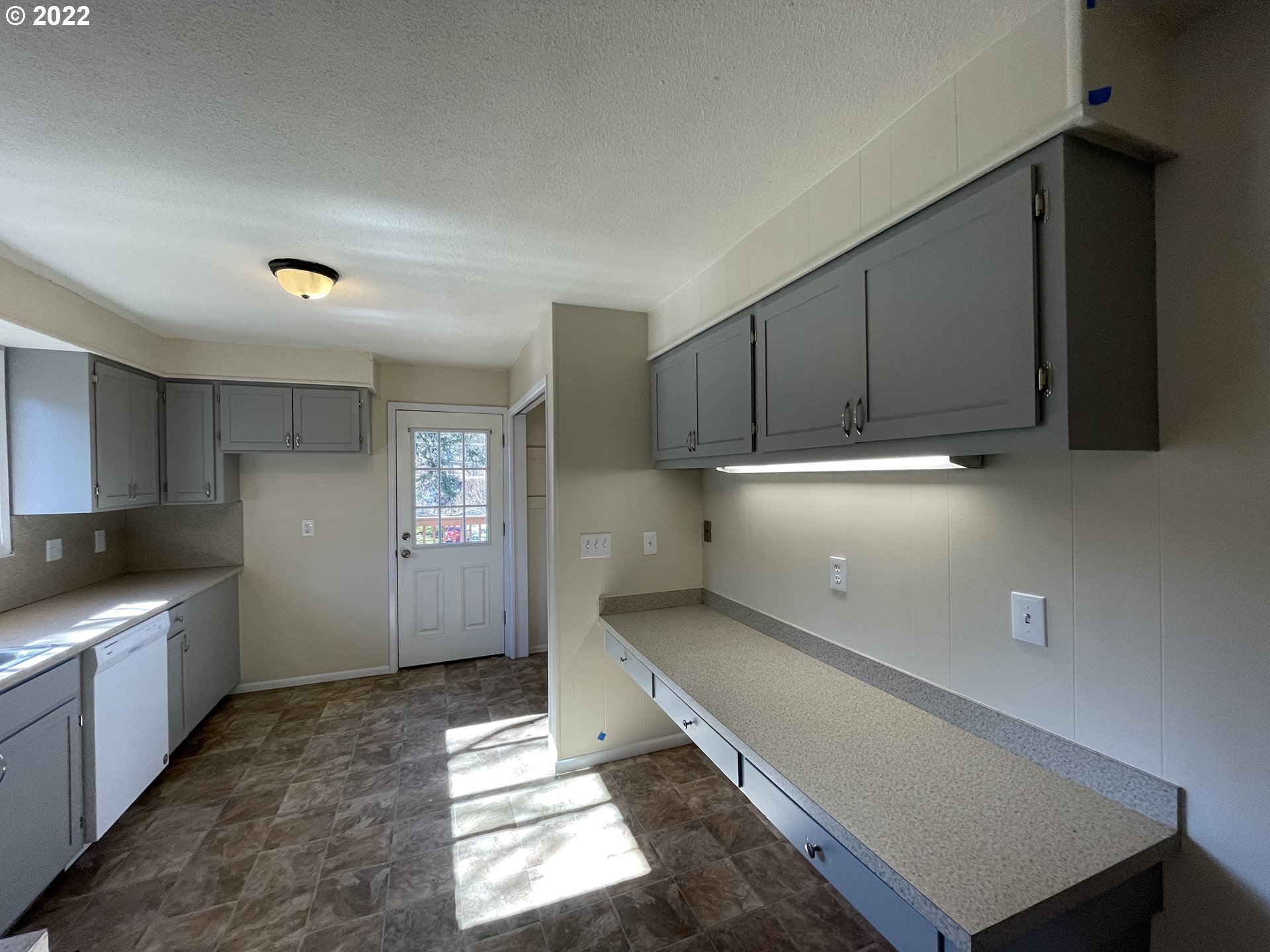 2901 Ingalls Way Eugene, OR 97405 - Photo 21 of 32 a kitchen with a sink and cabinets