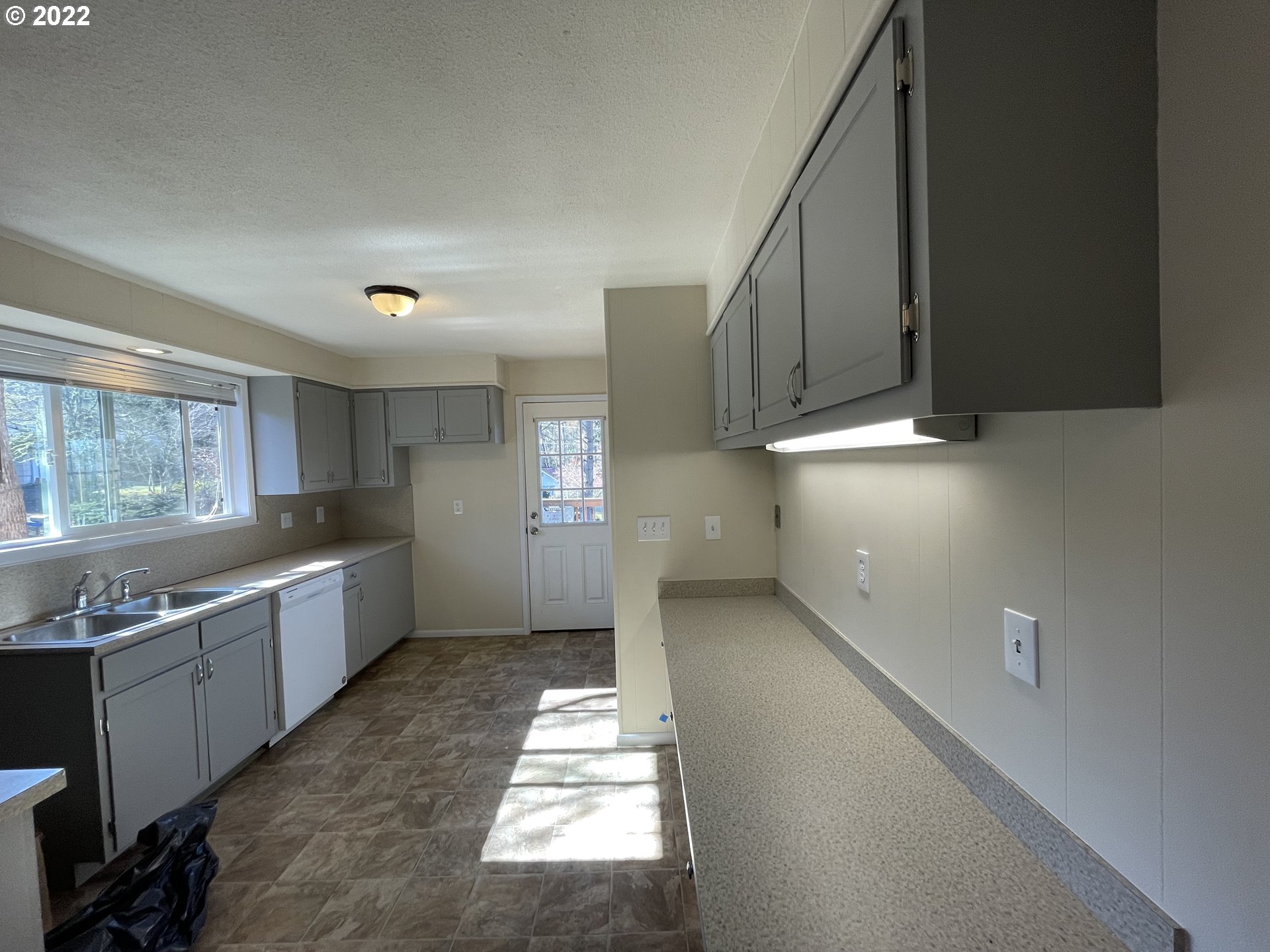 2901 Ingalls Way Eugene, OR 97405 - Photo 22 of 32 a kitchen with a sink and cabinets
