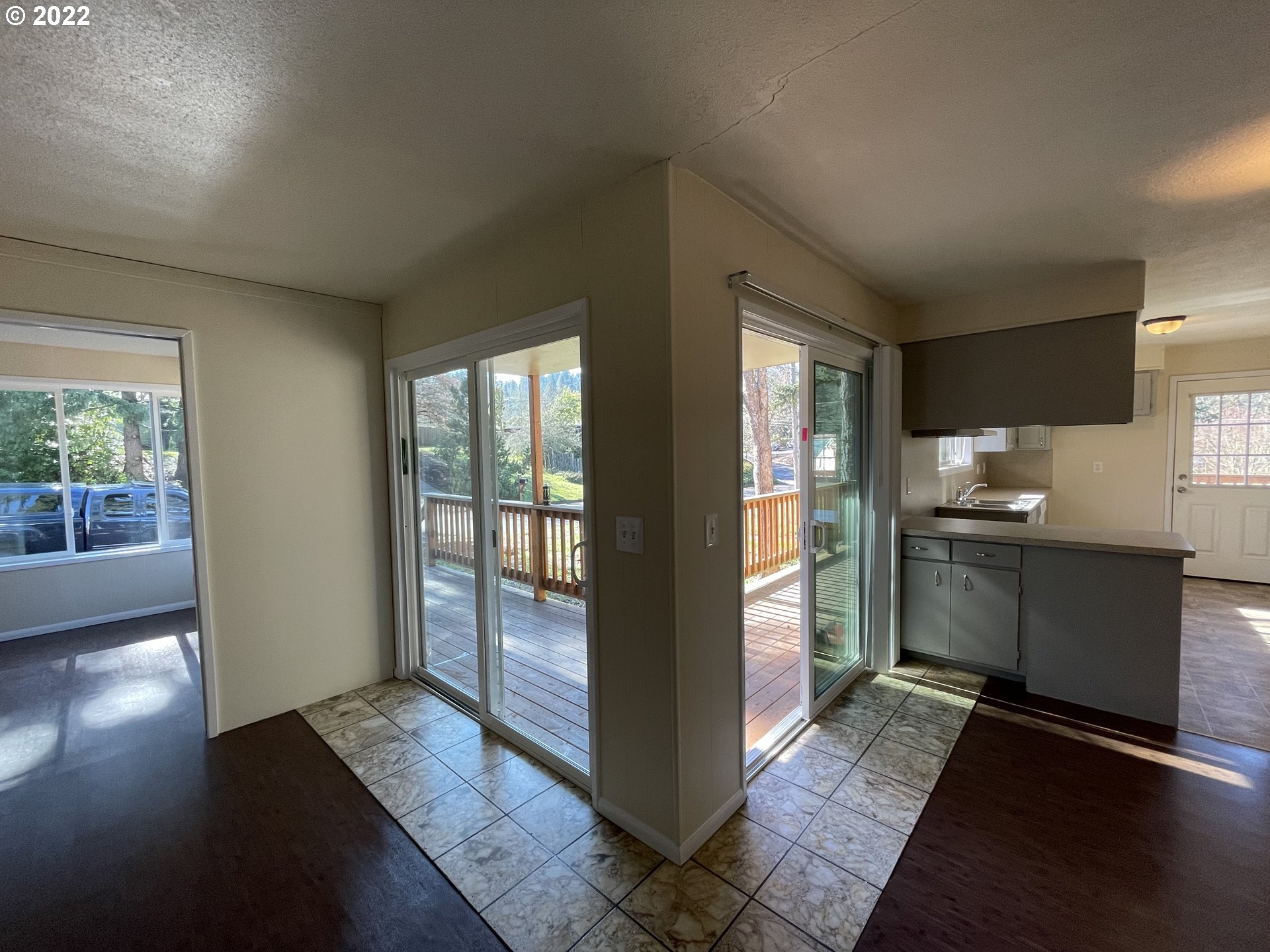 2901 Ingalls Way Eugene, OR 97405 - Photo 24 of 32 a kitchen with granite countertop a refrigerator and wooden floor
