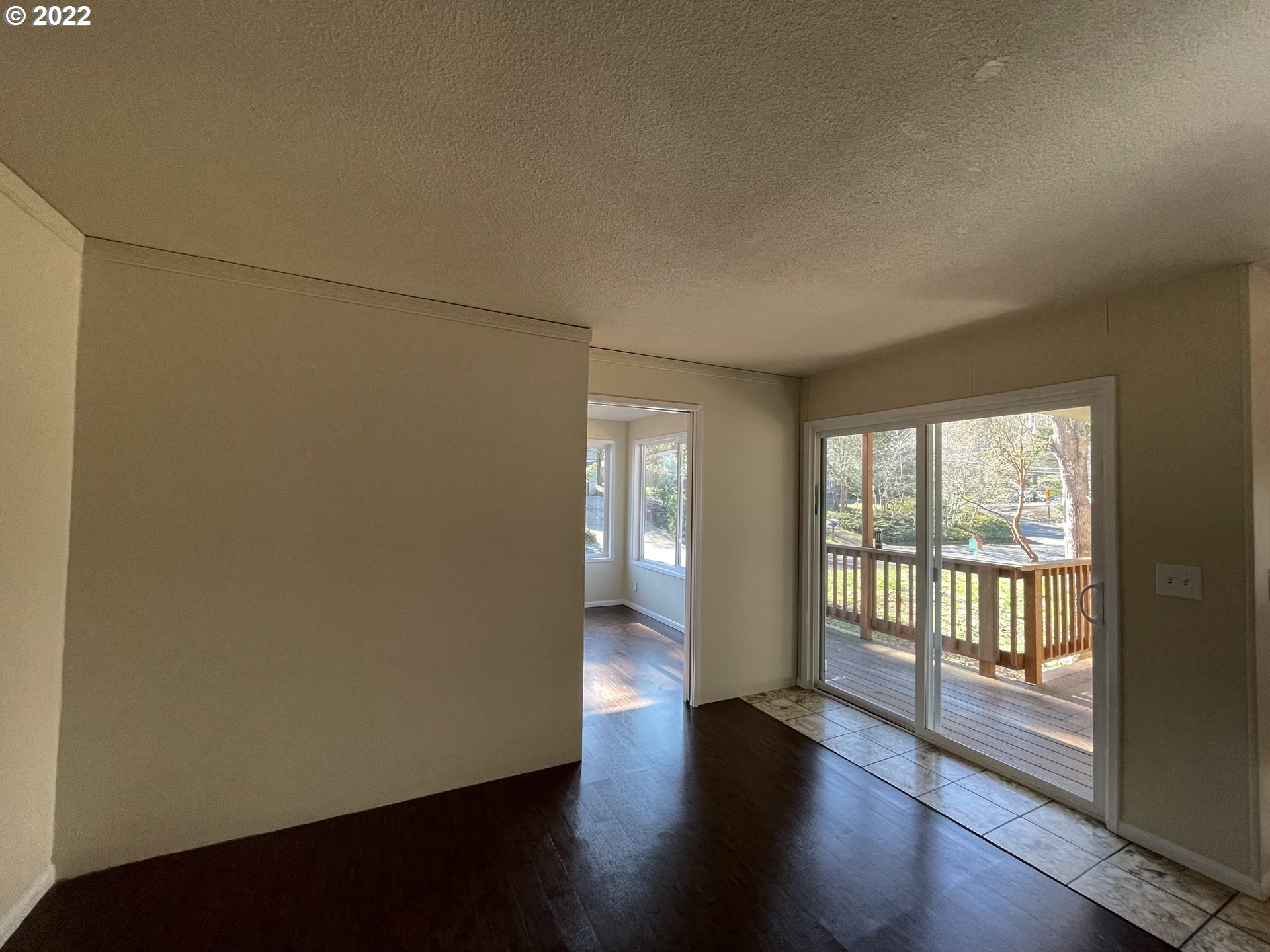 2901 Ingalls Way Eugene, OR 97405 - Photo 27 of 32 an empty room with wooden floor and windows