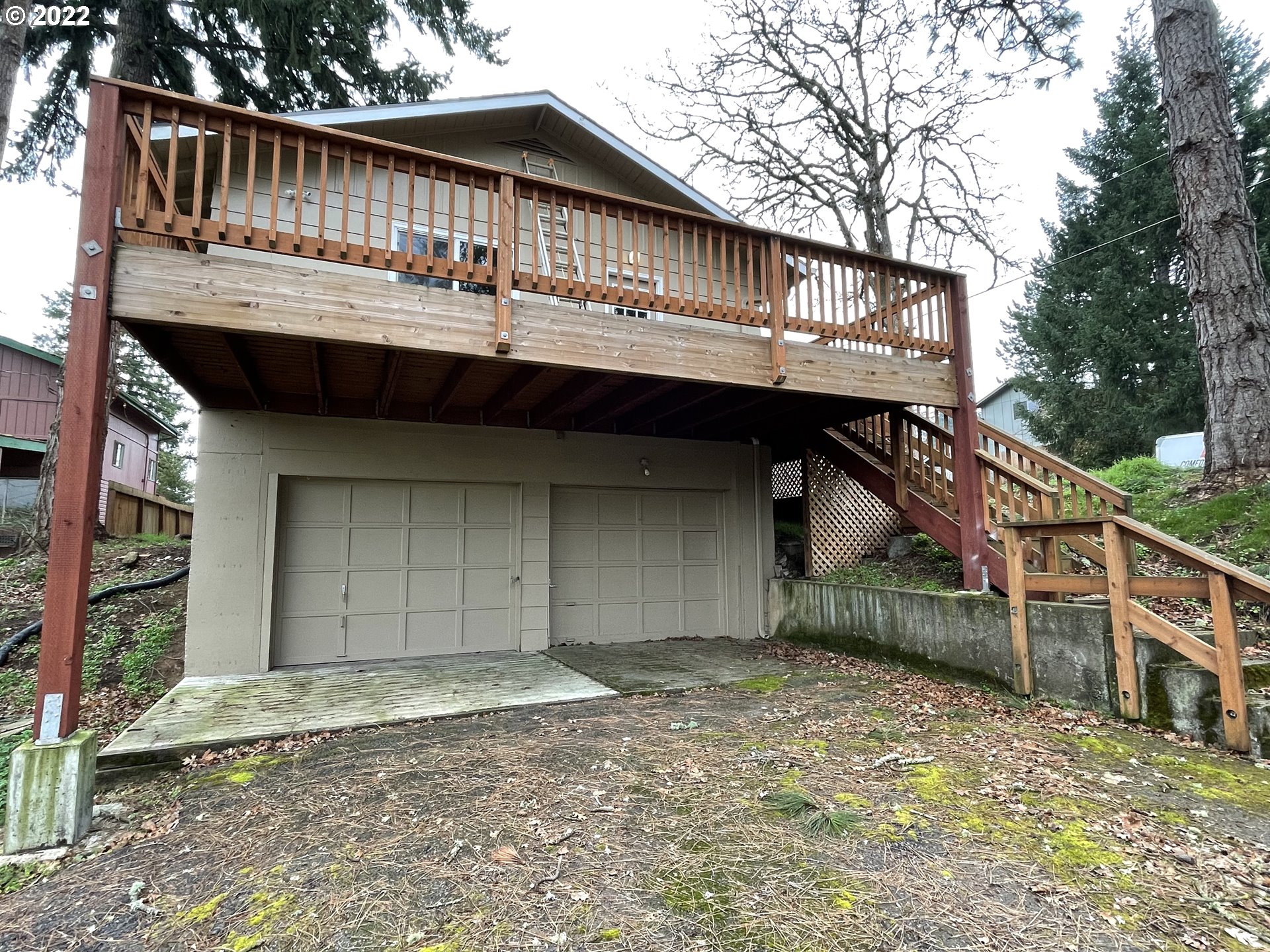 2901 Ingalls Way Eugene, OR 97405 - Photo 4 of 32 a front view of a house with a wooden deck