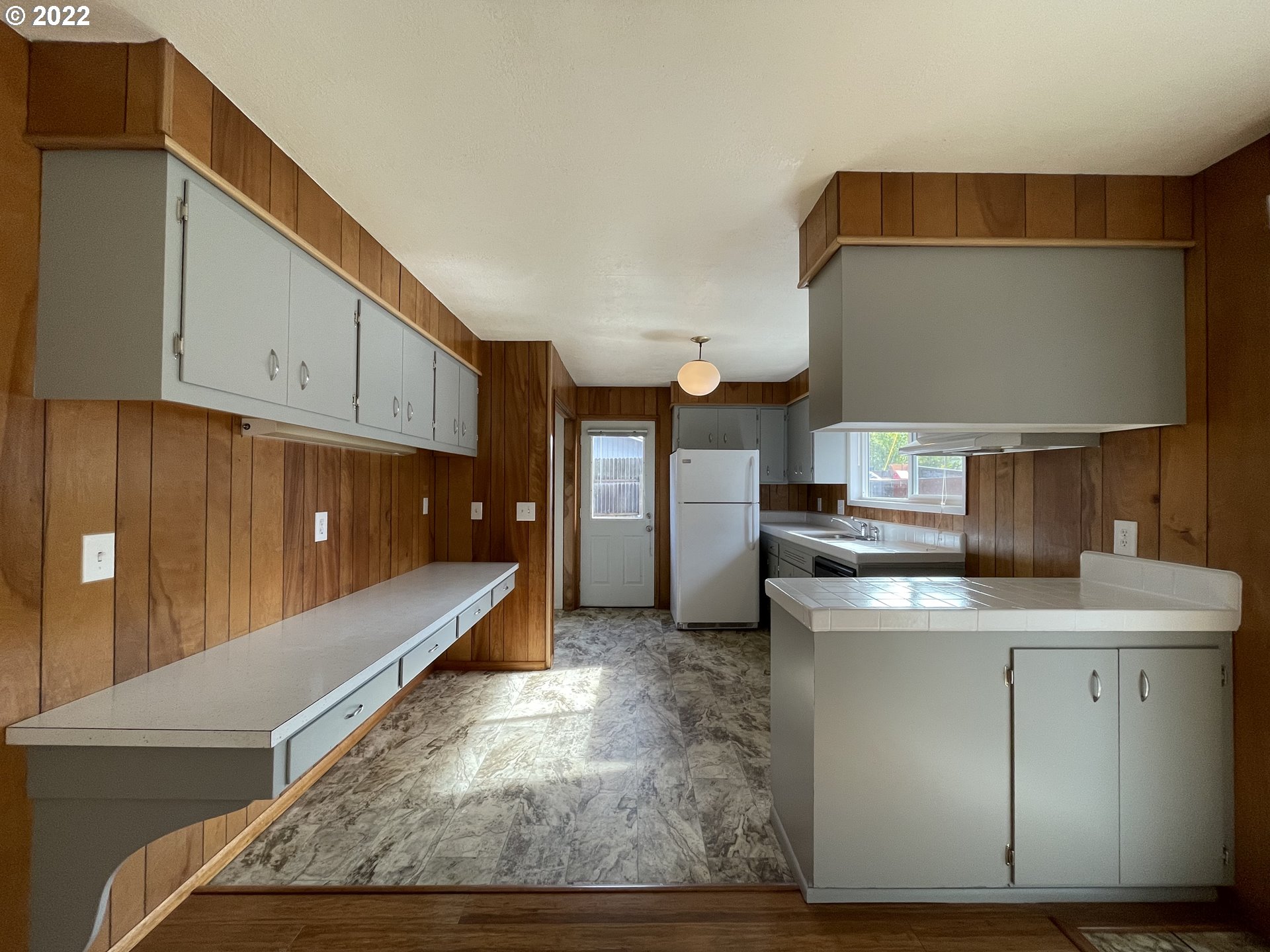 2901 Ingalls Way Eugene, OR 97405 - Photo 5 of 32 a kitchen with stainless steel appliances granite countertop a sink a stove and a wooden cabinets