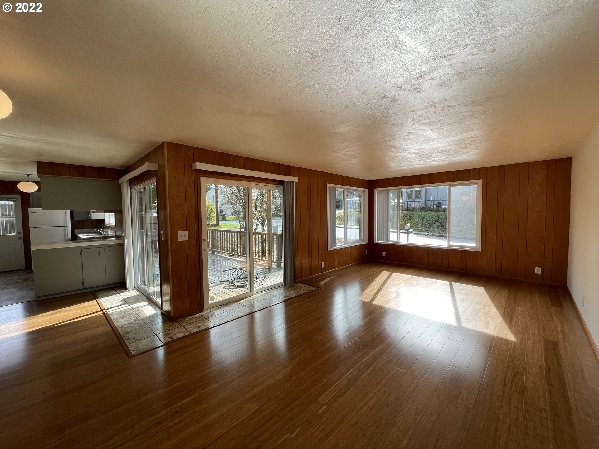 2901 Ingalls Way Eugene, OR 97405 - Photo 9 of 32 a view of an empty room with wooden floor and a window