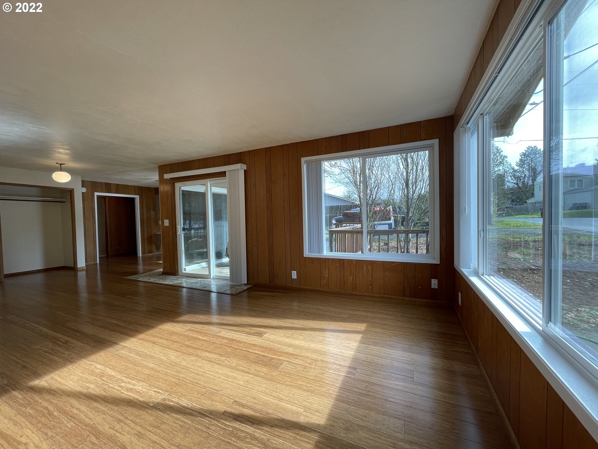 2901 Ingalls Way Eugene, OR 97405 - Photo 10 of 32 a view of an empty room with wooden floor and a window