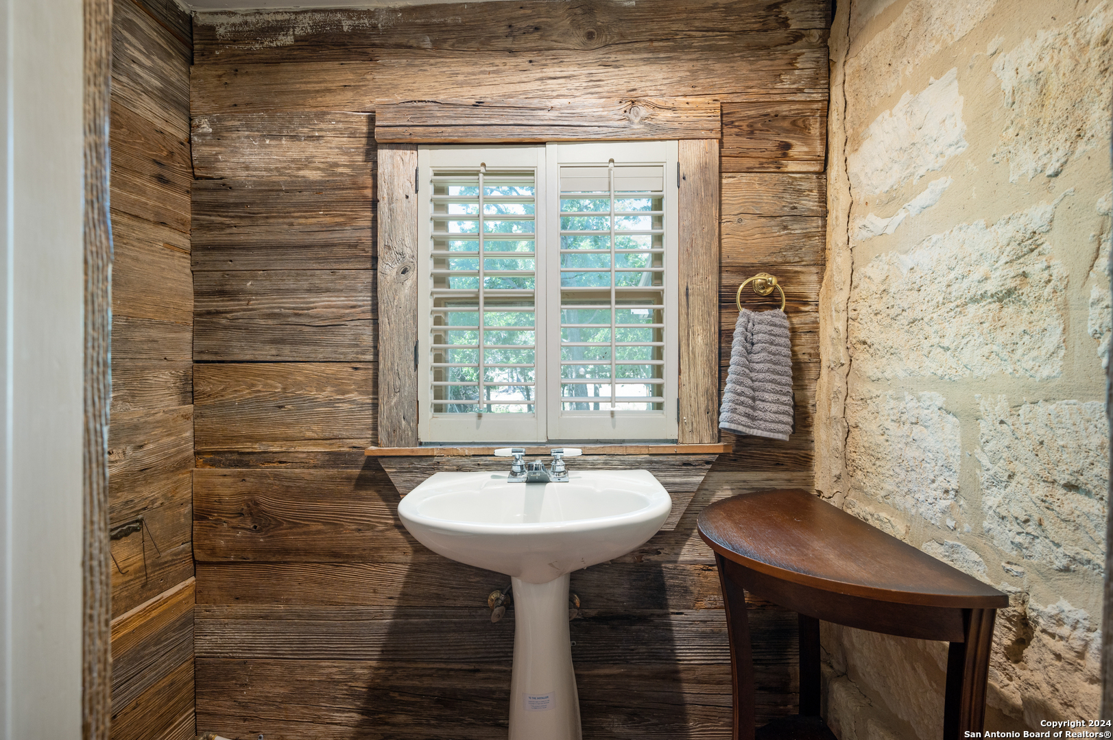 109 Waring Welfare Road Boerne, TX 78006 - Photo 13 of 21 a bathroom with a sink and a mirror