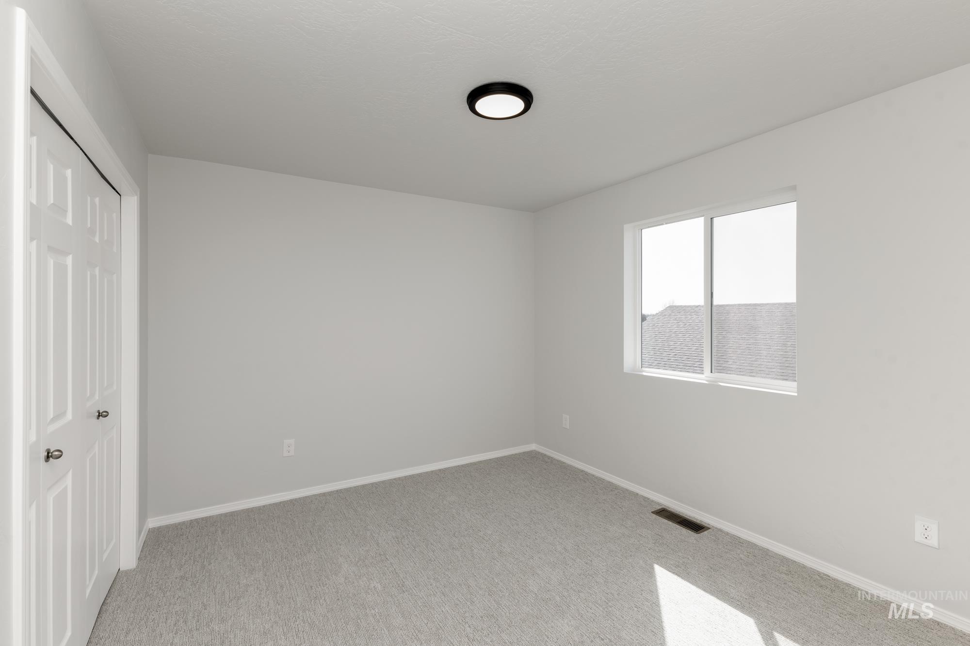 3270 South Maple Rnch Way Nampa, ID 83686 - Photo 21 of 31 Unfurnished bedroom featuring a closet and light colored carpet