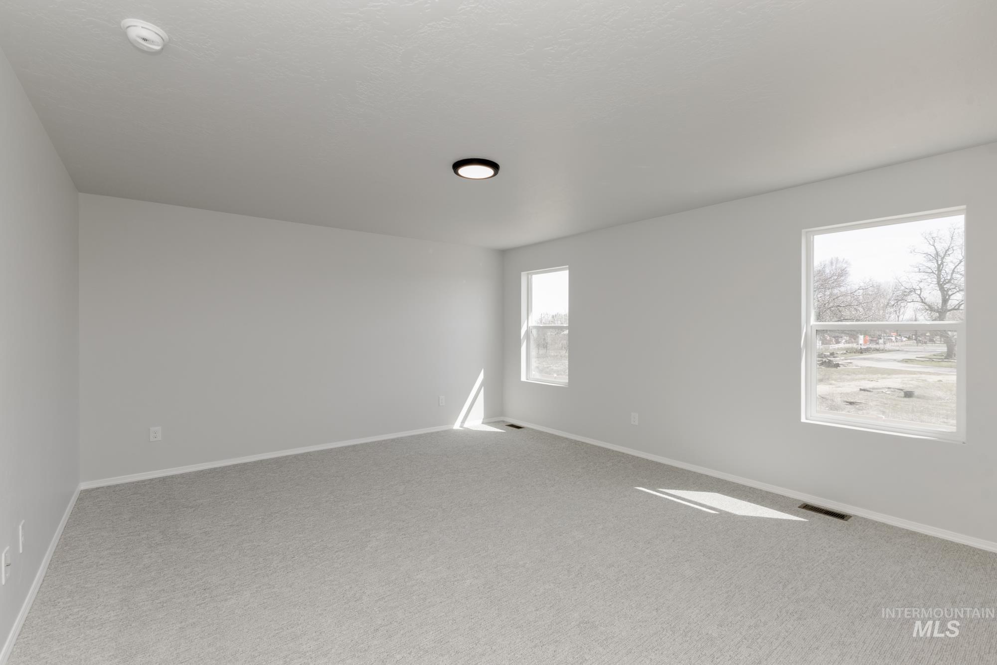 3270 South Maple Rnch Way Nampa, ID 83686 - Photo 26 of 31 Empty room with carpet floors and baseboards