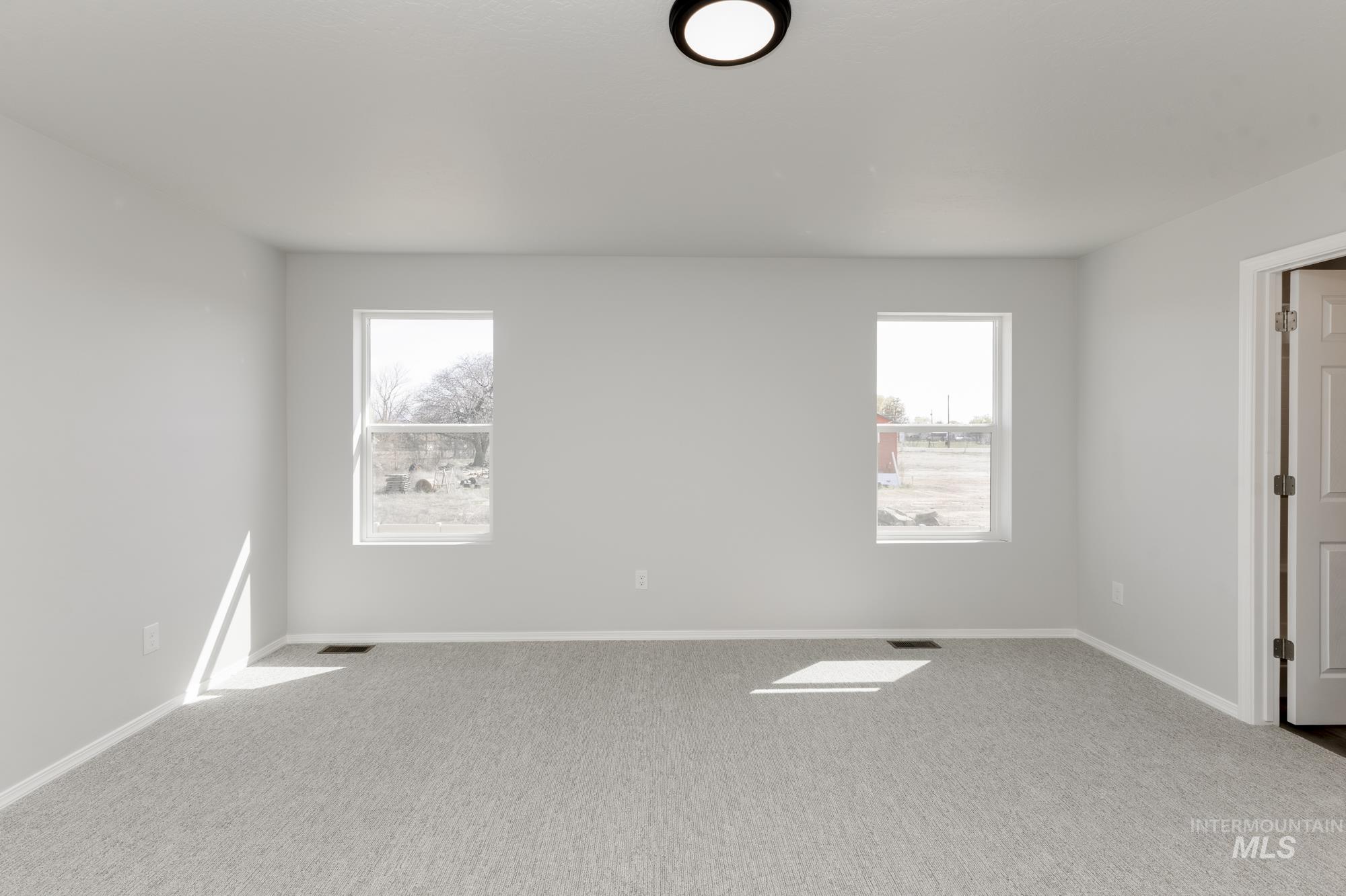 3270 South Maple Rnch Way Nampa, ID 83686 - Photo 27 of 31 Carpeted spare room with plenty of natural light