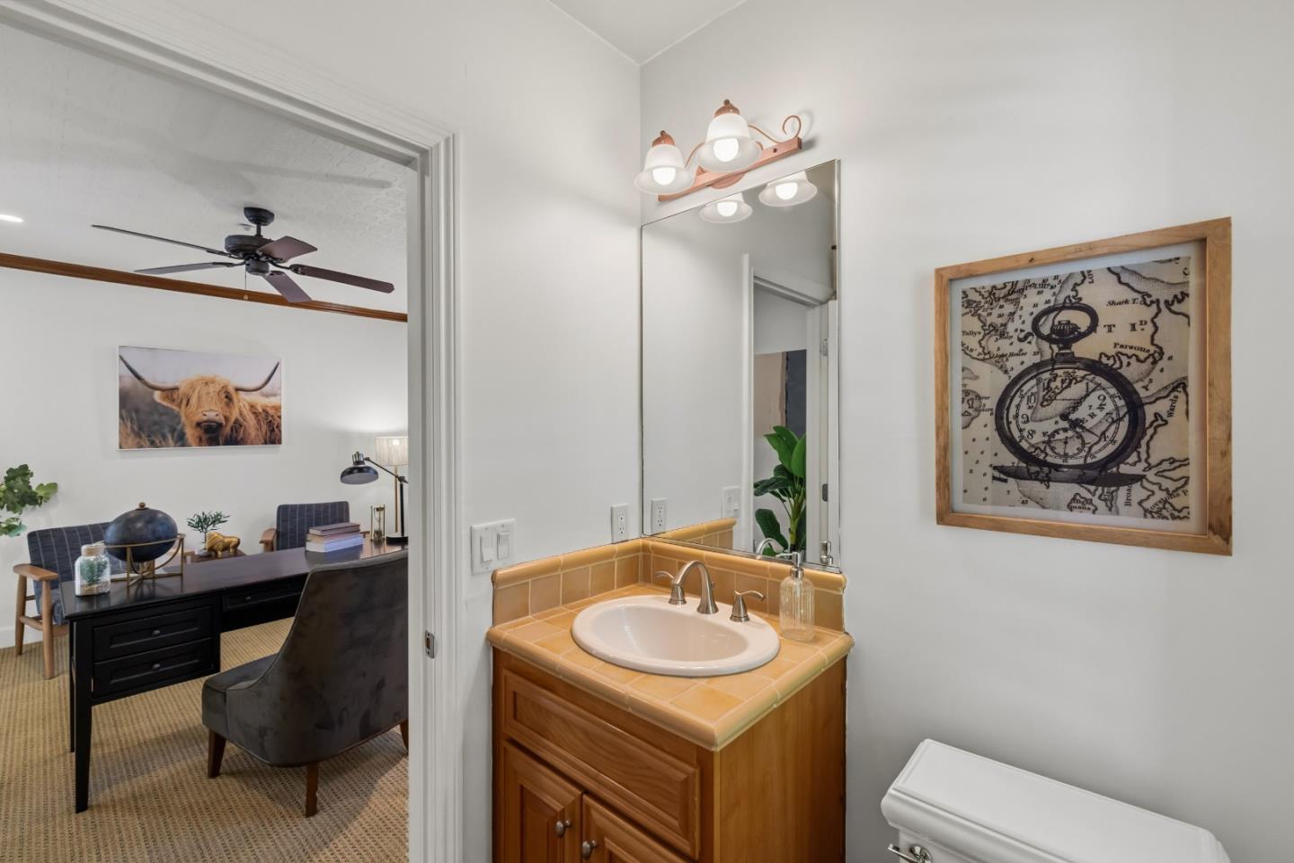 302 Pasadera Drive Monterey, CA 93940 - Photo 24 of 40 a bathroom with a toilet a sink and a mirror