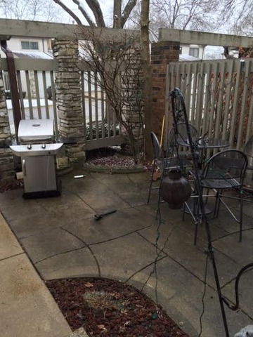 212 West Coventry Place Mount Prospect, IL 60056 - Photo 19 of 21 a view of a patio with table and chairs with wooden fence and plants