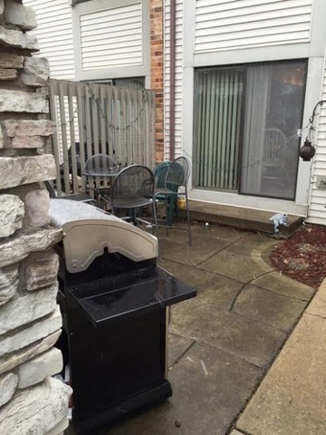 212 West Coventry Place Mount Prospect, IL 60056 - Photo 20 of 21 a view of a patio with table and chairs and a barbeque