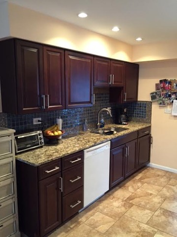 212 West Coventry Place Mount Prospect, IL 60056 - Photo 4 of 21 a kitchen with a sink a stove a microwave and cabinets