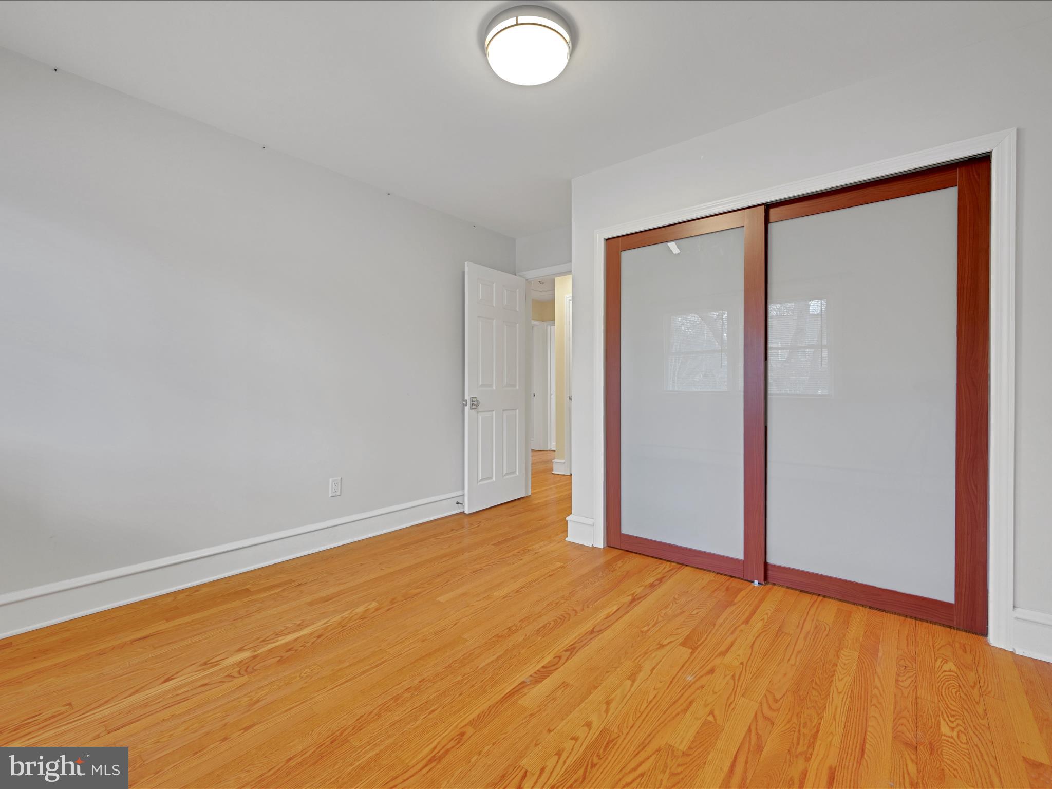 4500 Channing Road Wilmington, DE 19802 - Photo 14 of 35 an empty room with wooden floor and windows