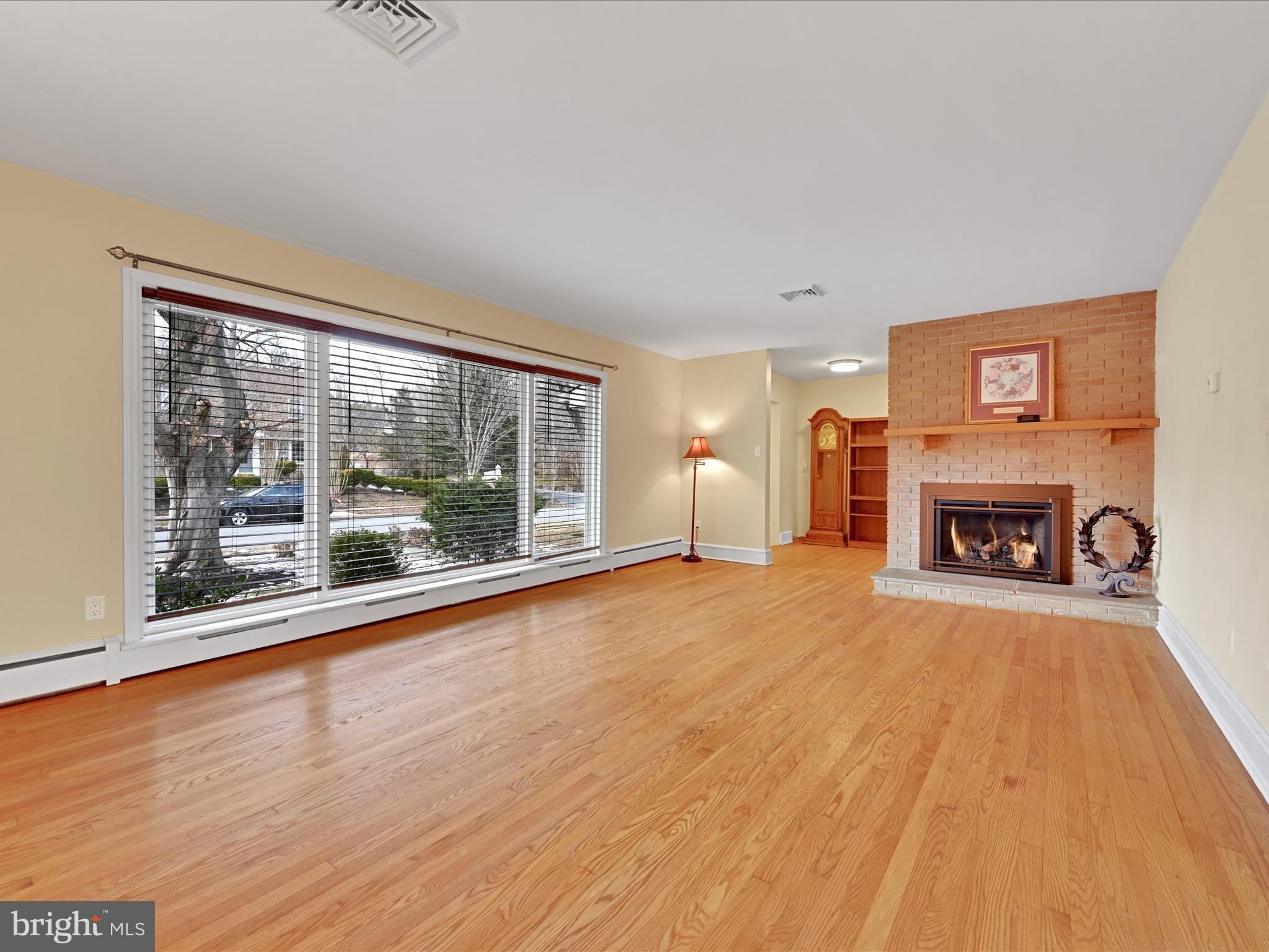 4500 Channing Road Wilmington, DE 19802 - Photo 6 of 35 a view of empty room with wooden floor and fireplace