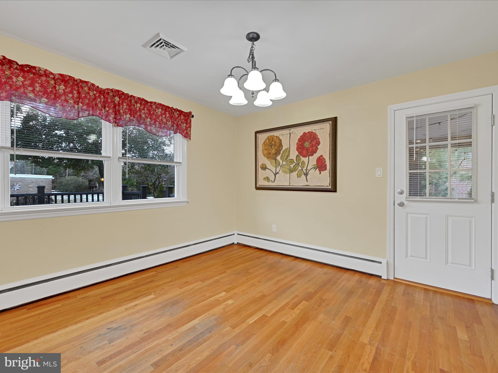 4500 Channing Road Wilmington, DE 19802 - Photo 7 of 35 a view of an empty room with a window and wooden floor