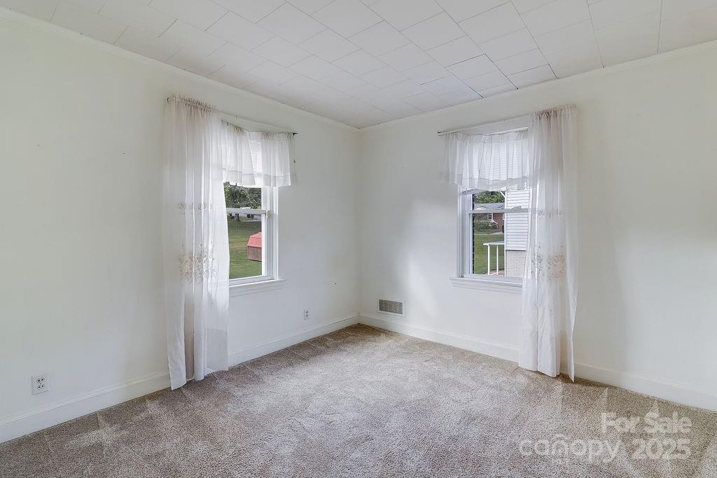 209 Park Street Morganton, NC 28655 - Photo 13 of 35 a view of an empty room with a window
