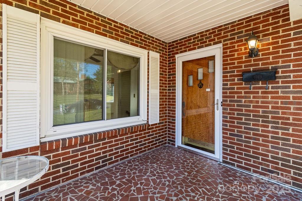 209 Park Street Morganton, NC 28655 - Photo 2 of 35 a view of a brick house with large windows