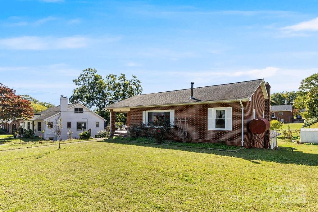 209 Park Street Morganton, NC 28655 - Photo 5 of 35 a front view of house with yard and trees around