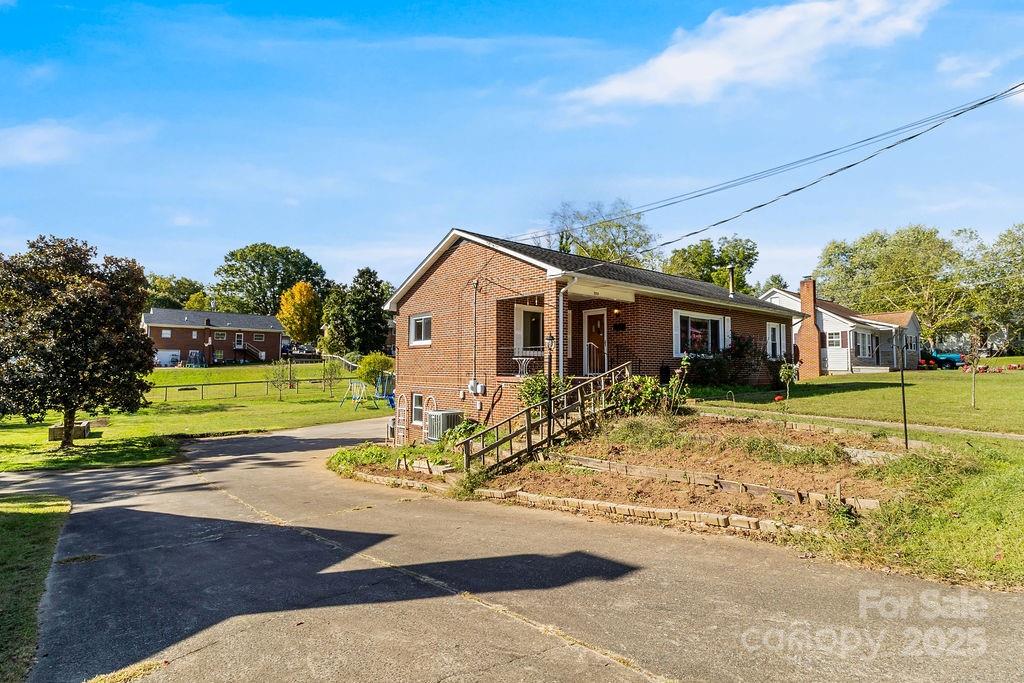 209 Park Street Morganton, NC 28655 - Photo 6 of 35 a view of a house with a yard