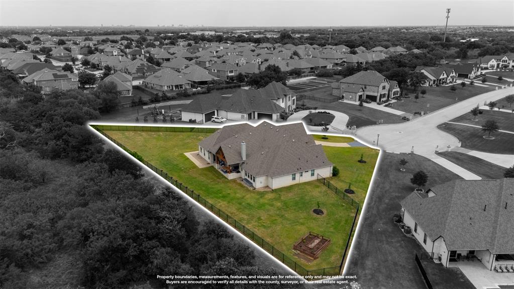 1060 Waters Edge Court Oak Point, TX 75068 - Photo 37 of 40 an aerial view of a house with a swimming pool