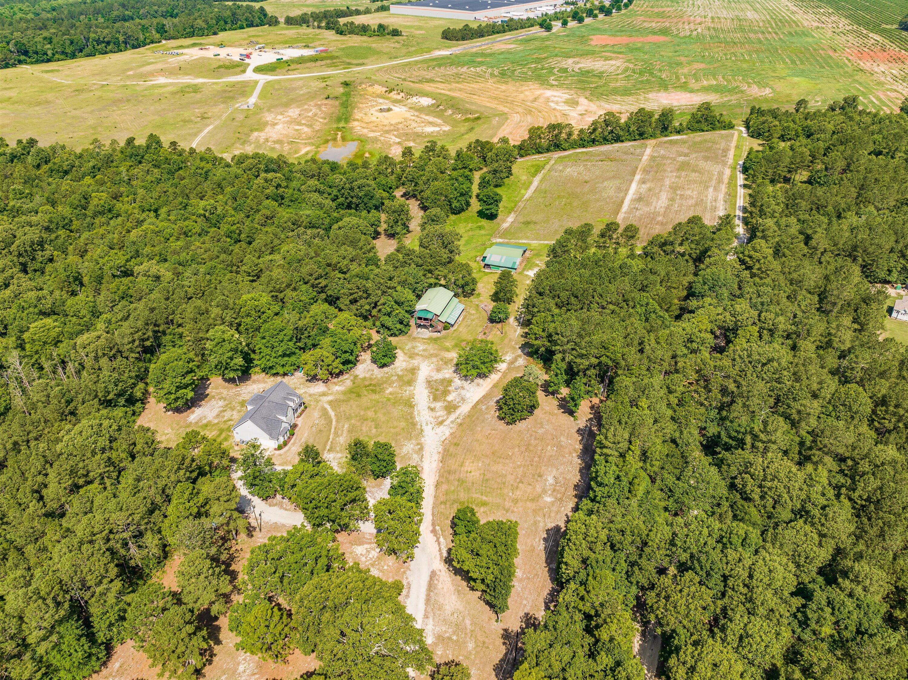 248 Windy Ridge Road Trenton, SC 29847 - Photo 5 of 63 View from driveway showing house, barndominium, utility shed and pasture