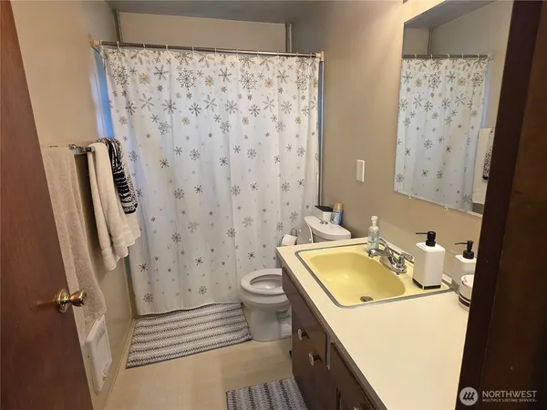 a room with a bed and a window