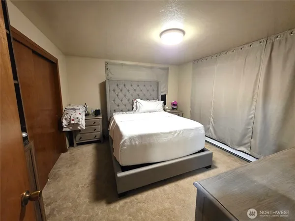 a bedroom with a bed and window